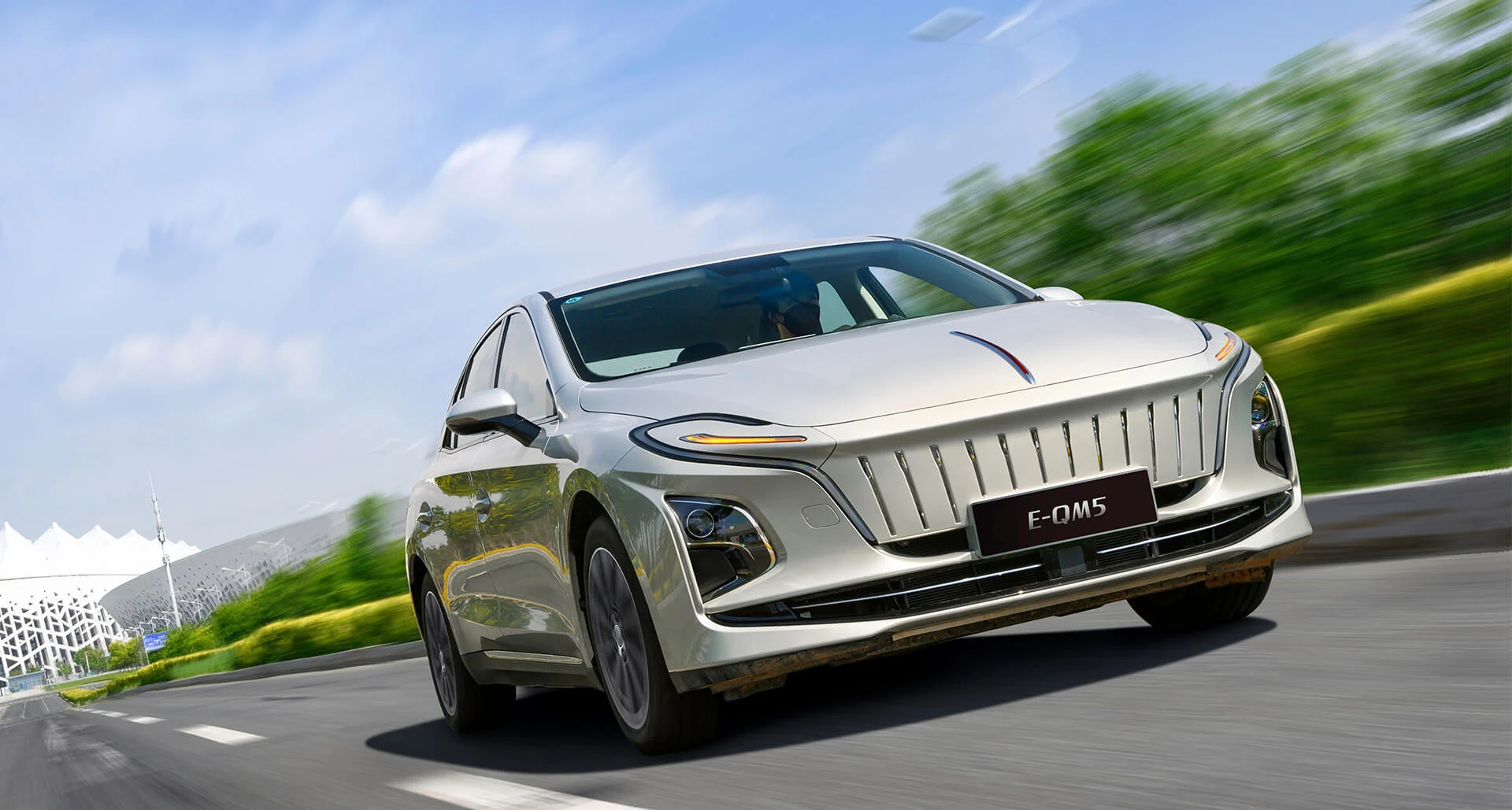 Silver Hongqi E-QM5 viewed from the front on a road, official model reference image